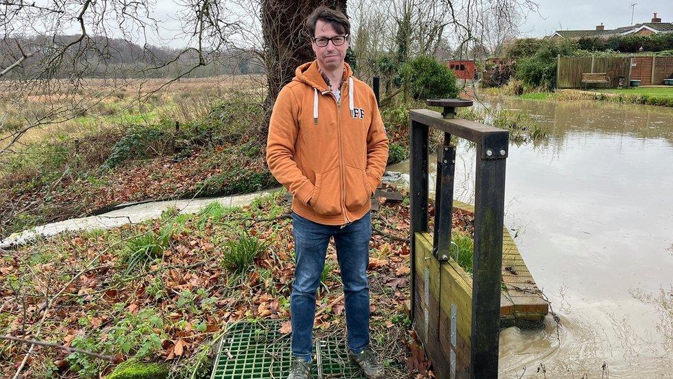 Warren Thornton uses a sluice-gate to manage the River Flit