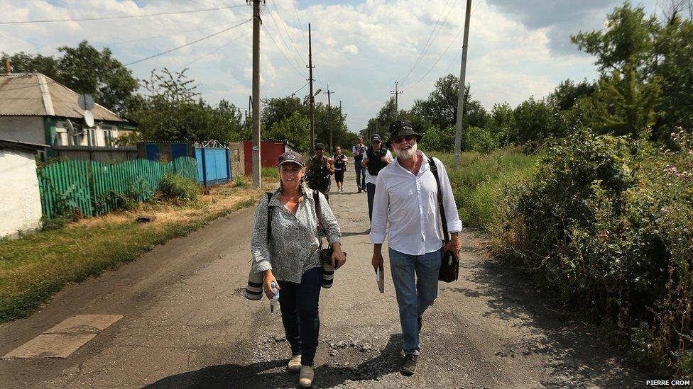 Journalists Kate Geraghty and Paul McGeough walking in Rassypnoye, East Ukraine