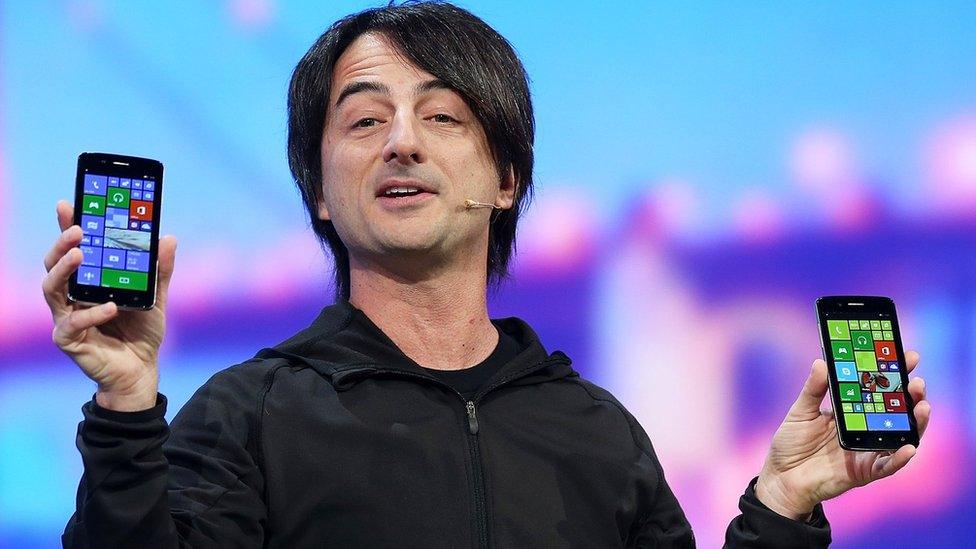 Joe Belfiore holding Windows phones