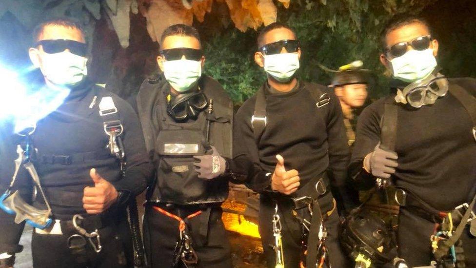 Rescue divers give the thumbs up in the cave July 2018