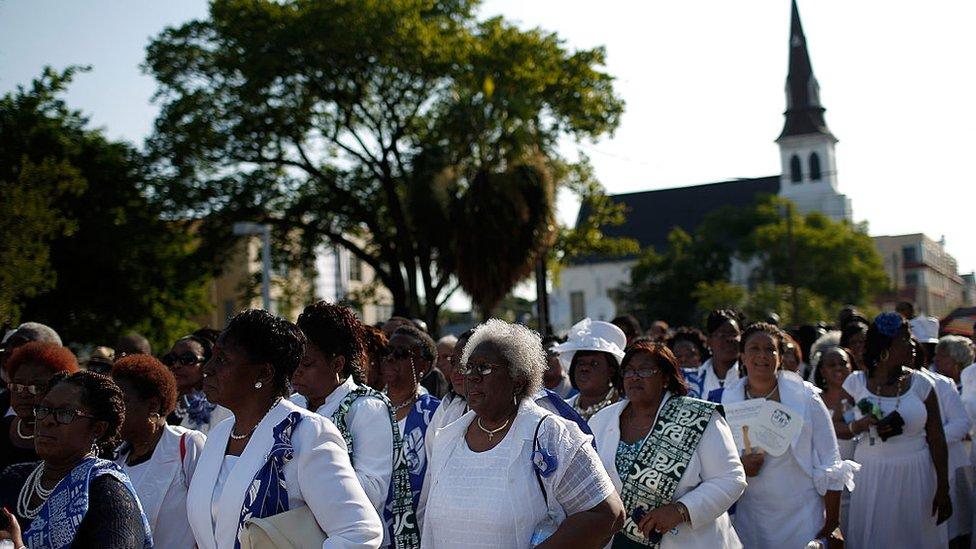 Mourners gather for the funeral of Rev Clementa Pinckney, killed in a mass shooting in Charleston in 2015