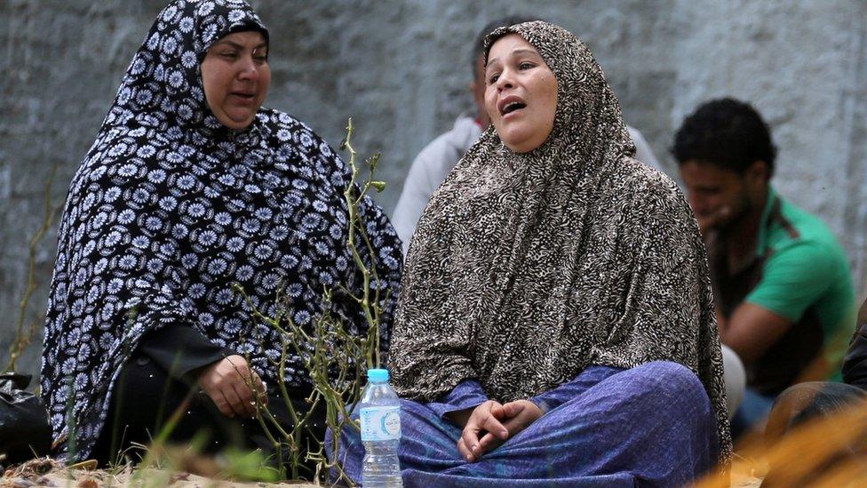 Relatives of missing persons from a capsized boat in the Mediterranean Sea are pictured in Al-Beheira, Egypt, September 22, 2016