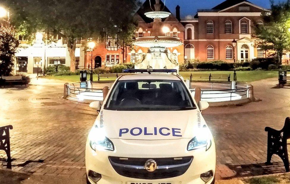 A police car parked in deserted Leicester city centre