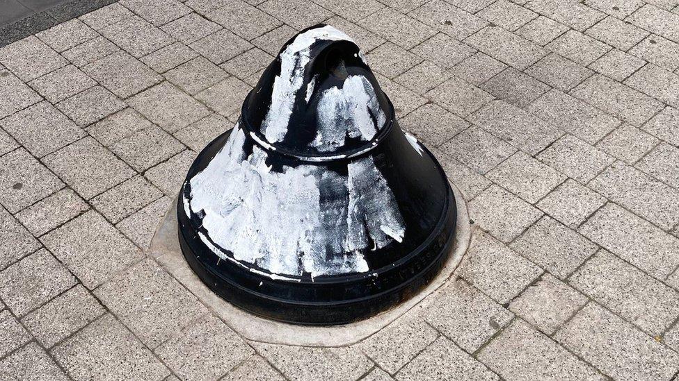 Pavement bollard painted