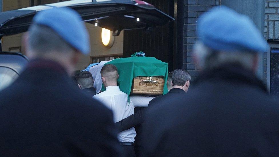 The coffin of Private Sean Rooney is carried into Holy Family Church, Dundalk, Co Louth