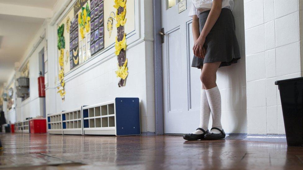 Girl outside classroom