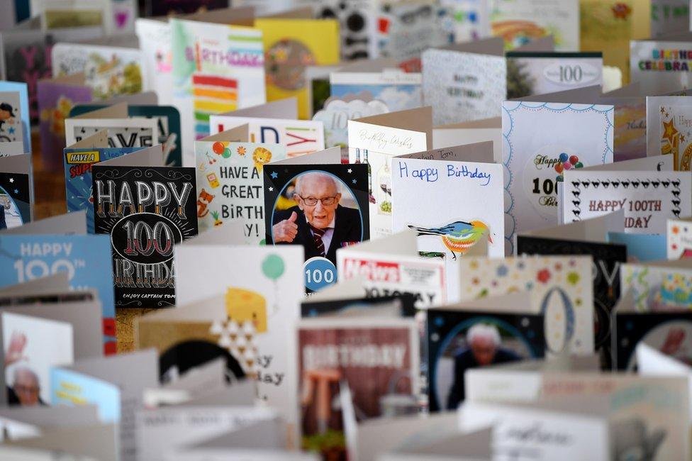 A view of thousands of birthday cards laid out in a large hall