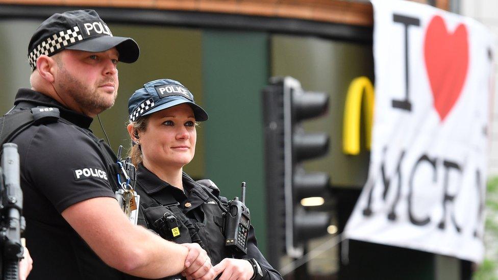 armed police protect crowds and athletes during Great Manchester Run