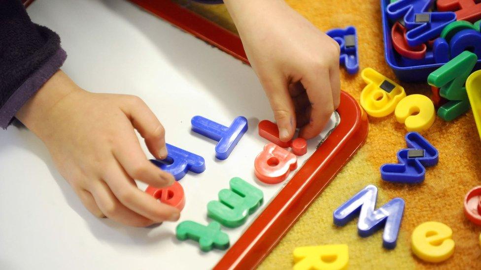 Child using magnetic letters