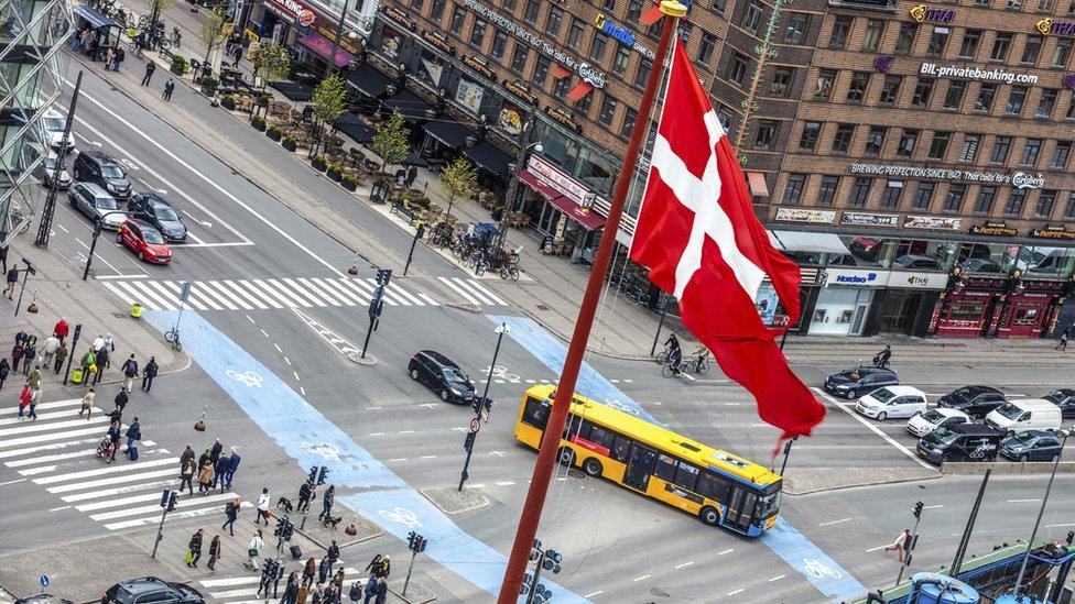 A Danish flag on a pole in central Copenhagen