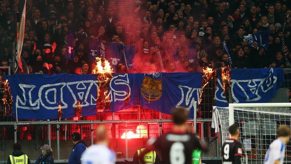 Eintracht fans burn Darmstadt banners during the Bundesliga match in December 2015