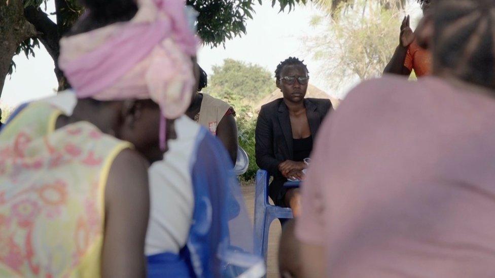 Woman talking to a group