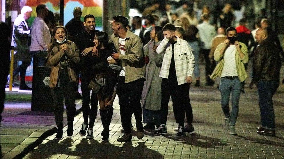 Canal Street in Manchester on the first Saturday since bars and pubs have been required to close at 10pm