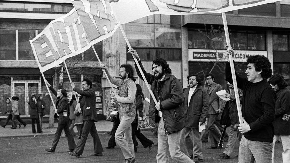 A picture of Victor Jara marching at a pro-Allende rally in 1973.