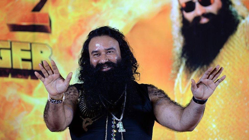 Indian chief of the religious sect Dera Sacha Sauda (DSS) Gurmeet Ram Rahim Singh gestures during a news conference to launch the score for his forthcoming film 'MSG-2 The Messenger' in Mumbai on September 8, 2015.