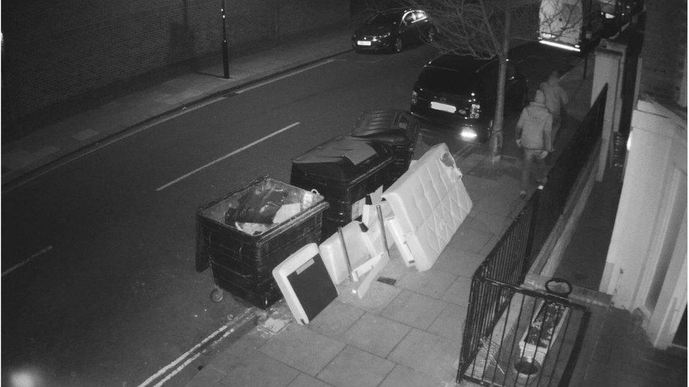 Black and white CCTV footage of fly tipping in Westminster