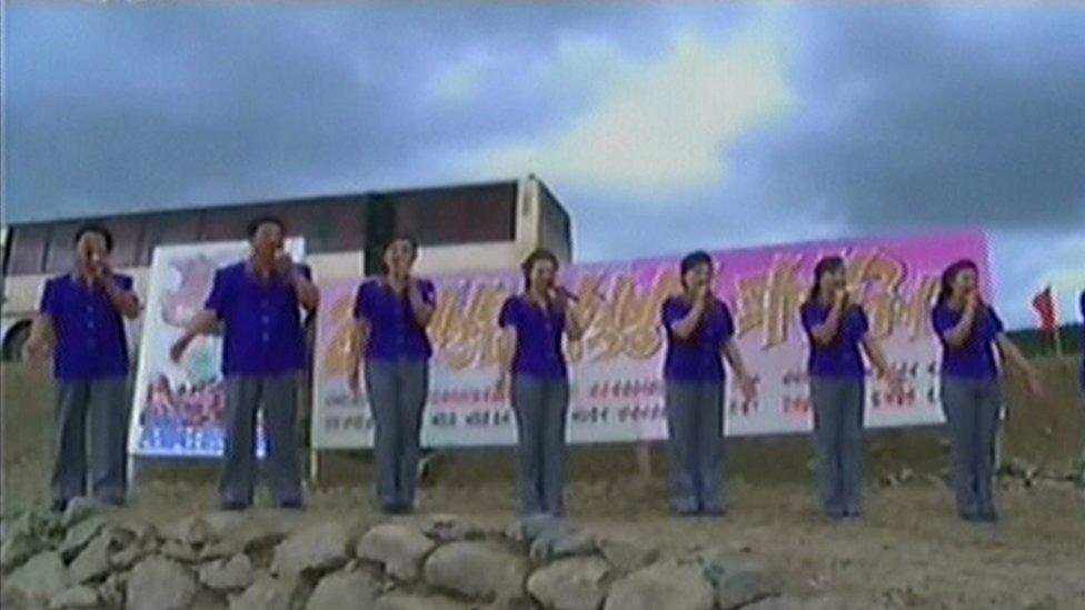 A band of singers sent to encourage the labourers