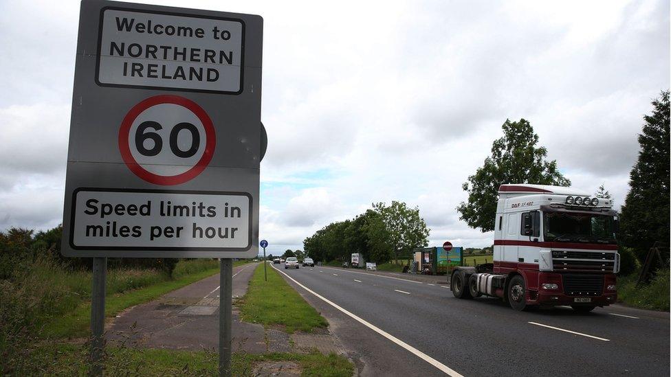 Traffic crossing the border between the Republic of Ireland and Northern Ireland in the village of Bridgend, Co Donegal