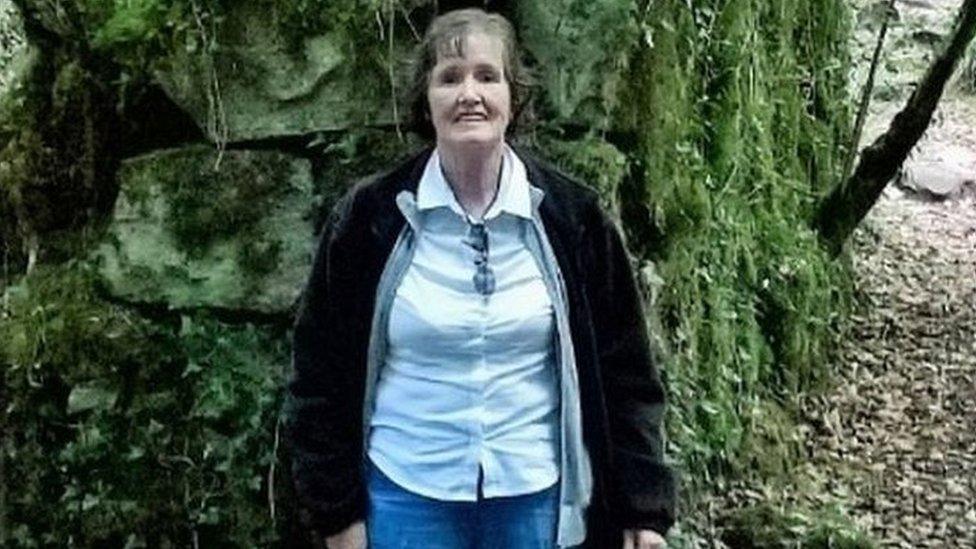 Patricia Finnie standing in a wooded area