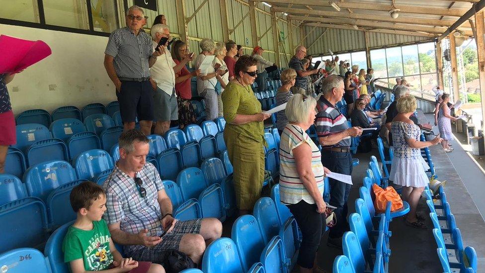 Choir members at Twerton Park in Bath
