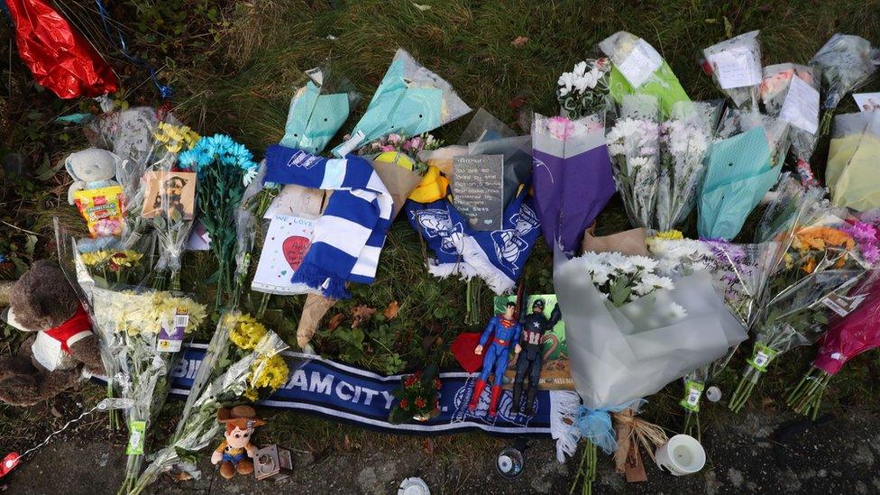 Tributes left outside house