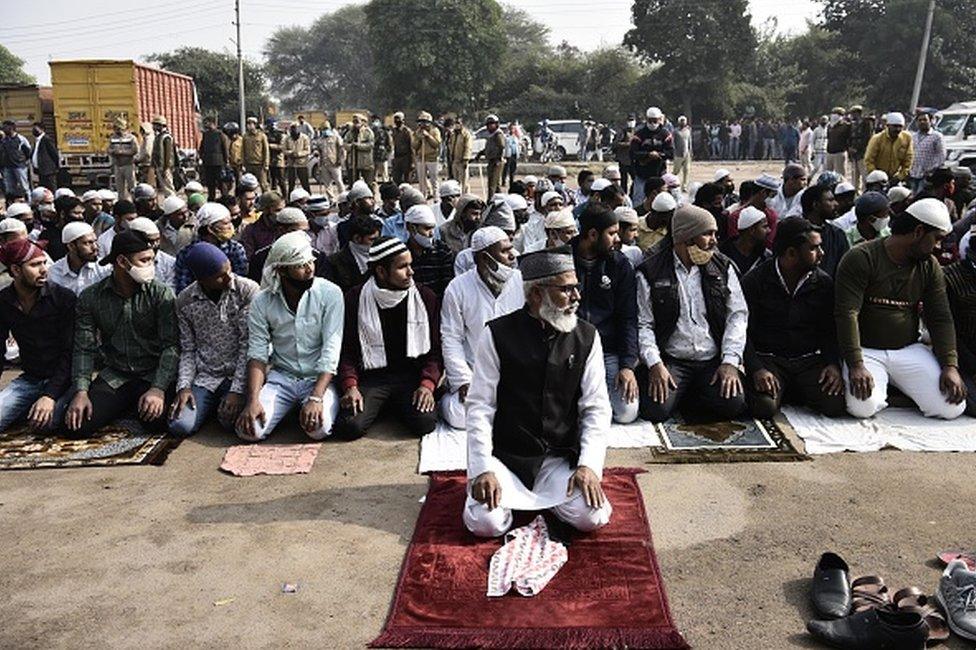 Muslim devotees offer Namaz at Sector 37 parking area amidst protests, on December 3, 2021 in Gurugram, India. Heavy police deployment was made to avoid any untoward incident.