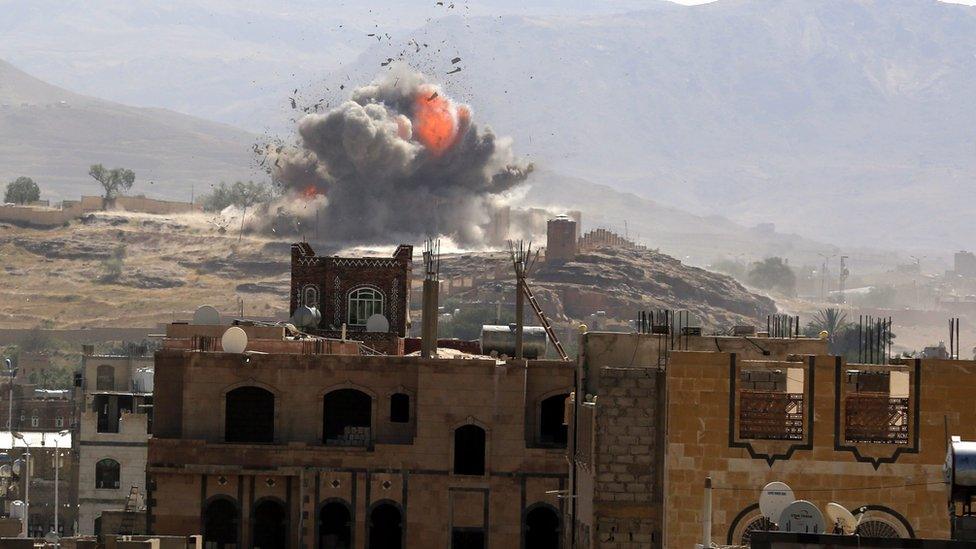 Smoke and flames rise from military position in Sanaa after reported Saudi-led coalition air strike (25 September 2016)