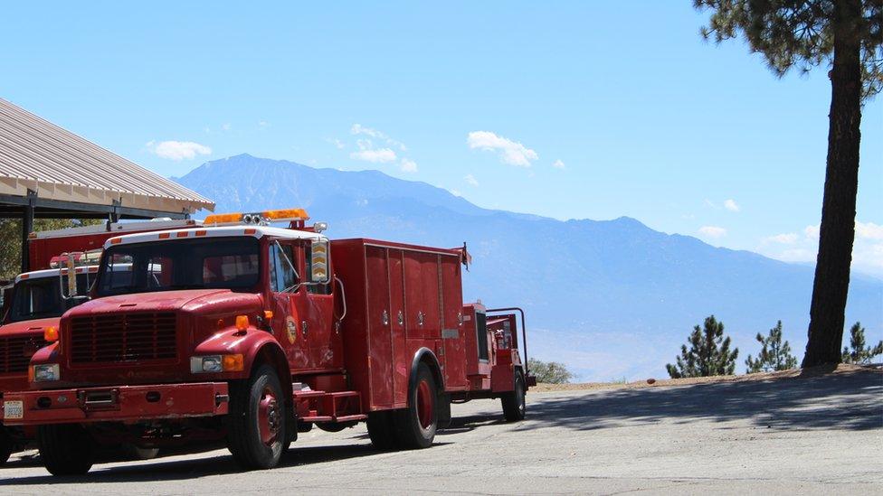 Fire engines with mountain backdrop