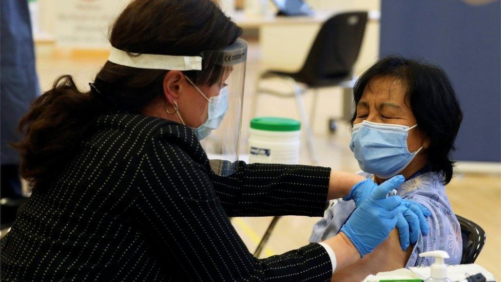 Anita Quidangen receiving vaccine