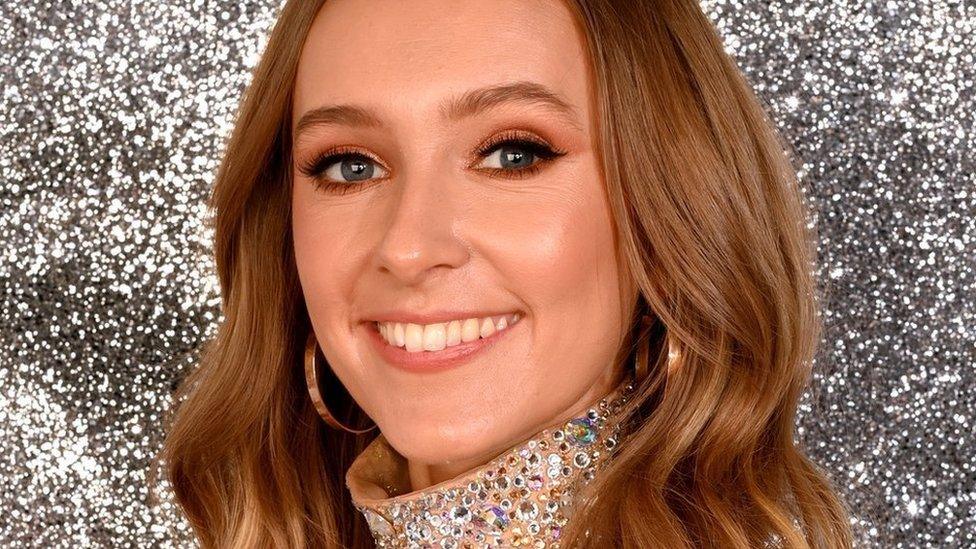 Rose Ayling-Ellis smiling at the camera wearing a sparkly dress