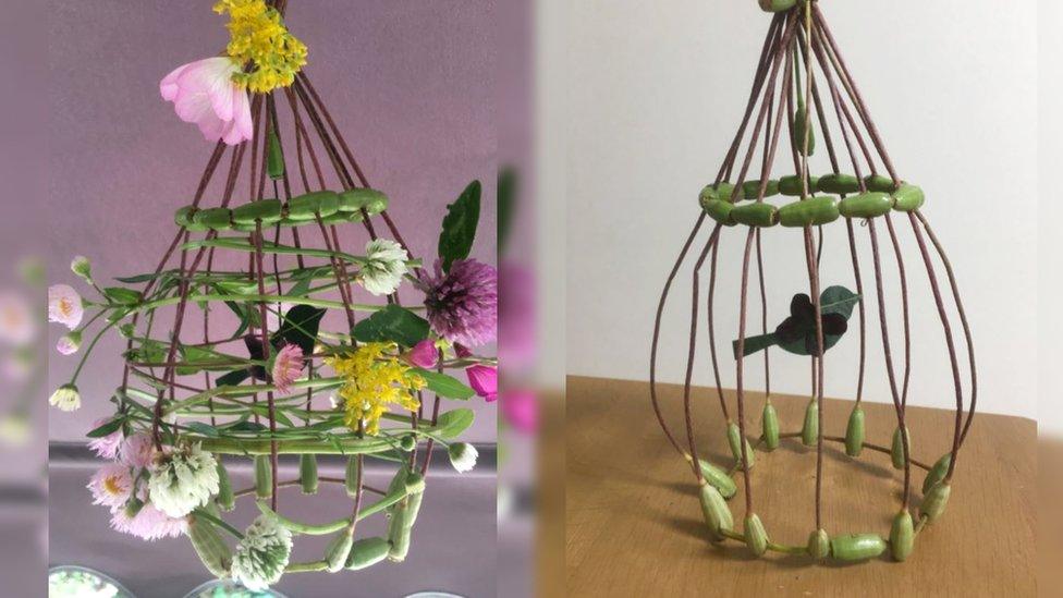 Birds in birdcages made from flowers