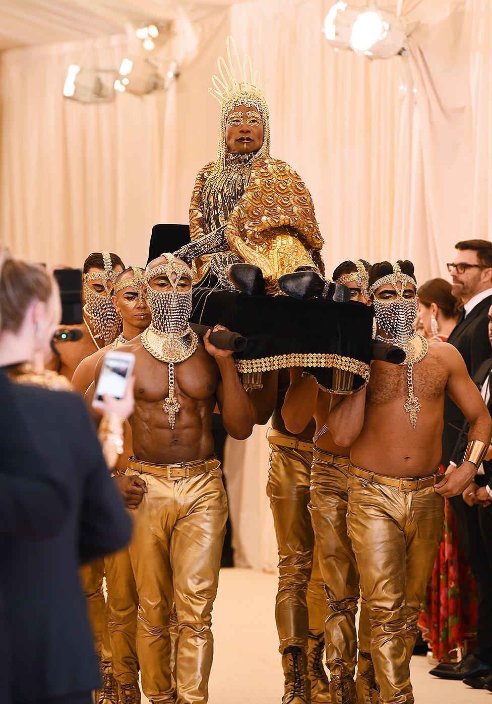 Billy Porter being carried into the Met Gala