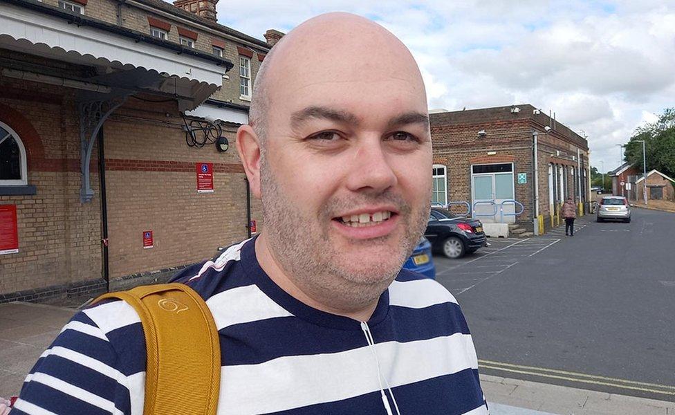 Gary Hughes in front of Ipswich rail station