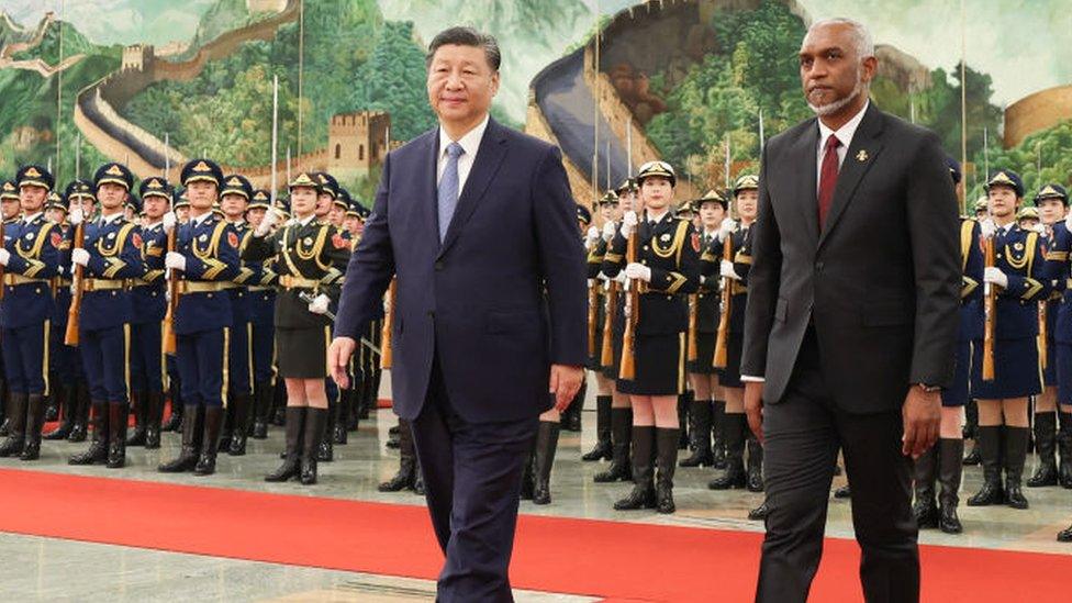 Maldives' President Mohamed Muizzu and Chinese President Xi Jinping walking during a welcome ceremony at the Great Hall of the People in Beijing on 10 January