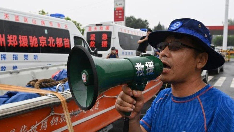 Rescuers pictured in Henan province