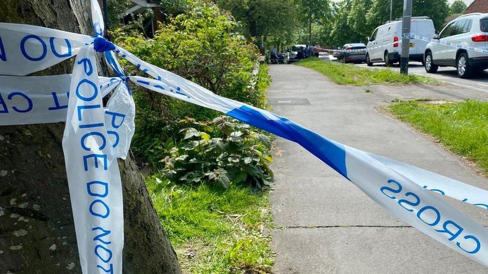 Police tape tied around a tree in Greystoke Gardens