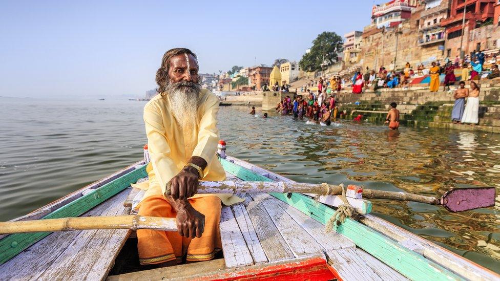 Man-rowing-on-the-river-Ganges.