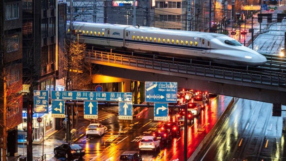 A A shinkansen or bullet train arriving in Tokyo