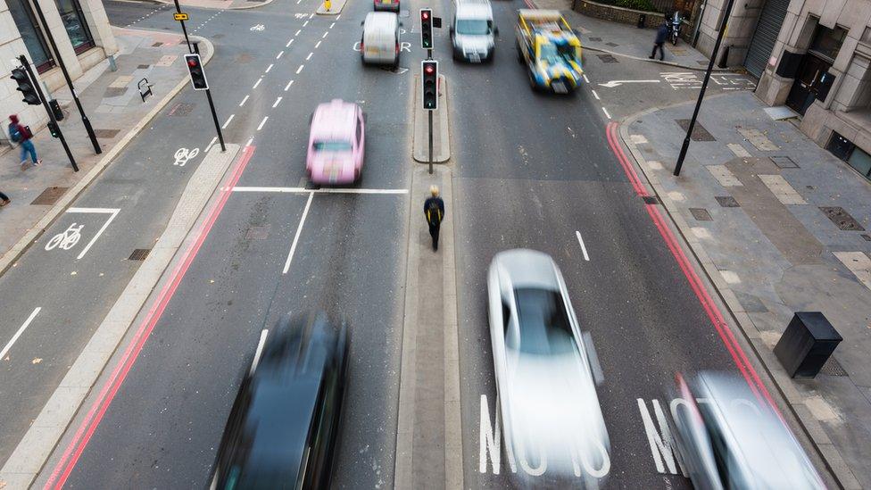 Cars on a street.