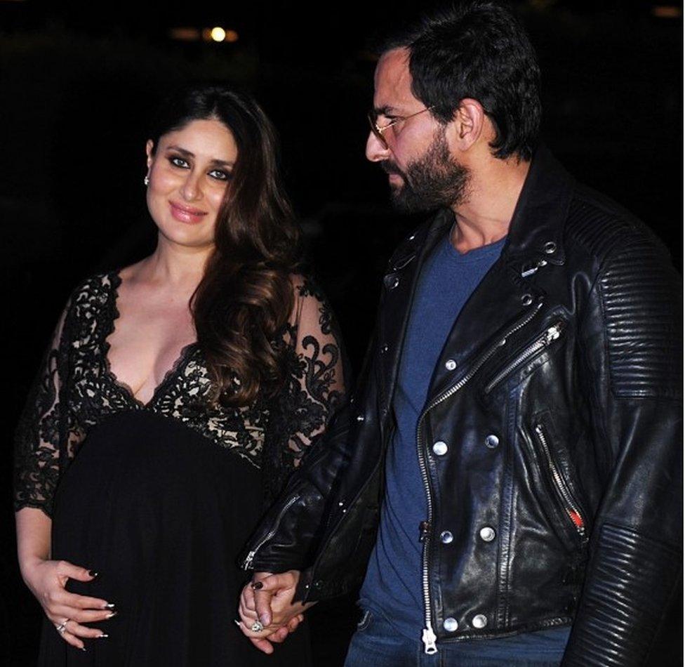 Indian Bollywood actors Saif Ali Khan (R) and Kareena Kapoor Khan pose for a photograph in Mumbai on December 5, 2016