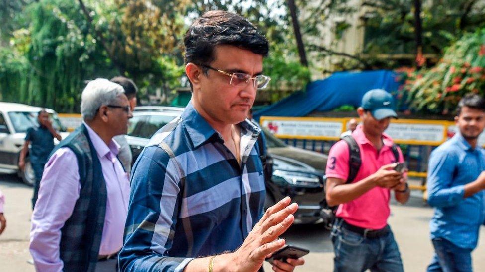 Former cricket captain Sourav Ganguly (C) gestures as he arrives at the Board of Control for Cricket in India (BCCI) headquarters at Wankhede stadium to file nomination for the board's elections in Mumbai on October 14, 2019.