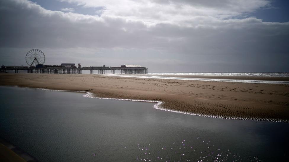 Blackpool's Golden Mile is deserted of holiday makers and locals as people and businesses observe the pandemic lockdown and stay home