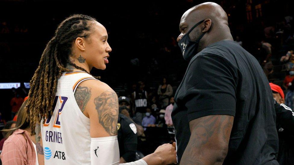 Griner with NBA legend Shaquille O'Neal.