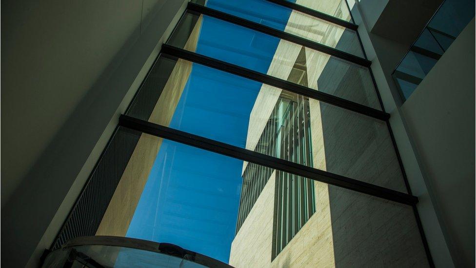 Glass and steel - looking out to part of the building from inside another part of Pontio