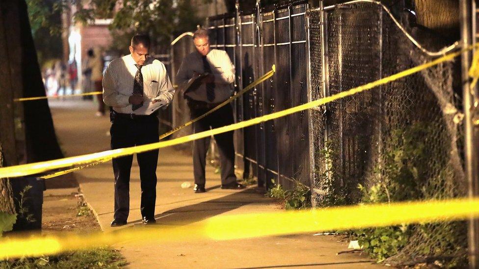 Crime scene tape is stretched around the front of a home where a man was shot in Chicago, Illinois, on 28 May 2017