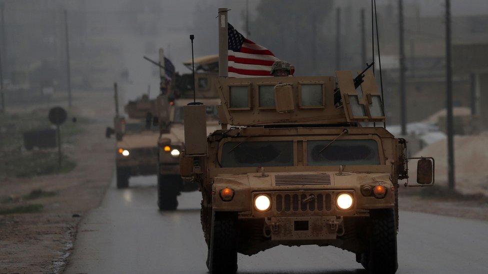 A picture taken on December 30, 2018, shows a line of US military vehicles in Syria's northern city of Manbij