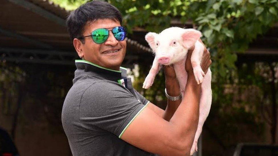 Ravi Babu with the piglet named Bunty