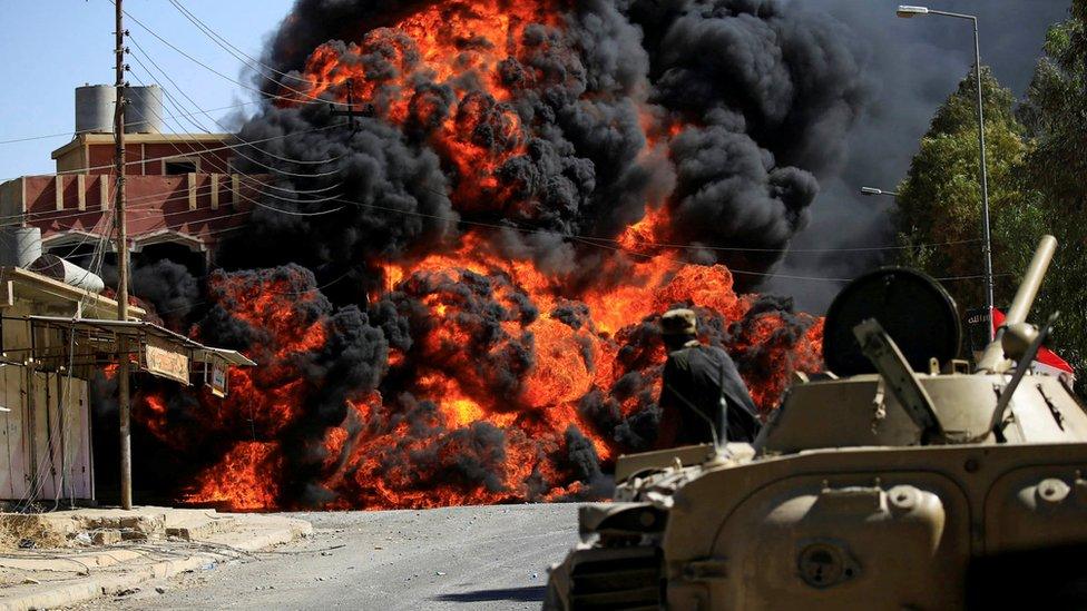 Smoke rises during clashes between Iraqi forces and so-called Islamic State (IS) militants in Tal Afar, 26 August 2017