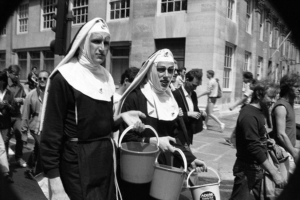 People attend the Pride march in 1983