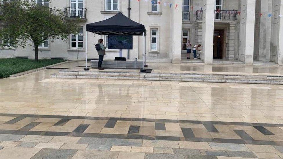 A screen was set up outside Walthamstow Town Hall, but few people came to see the Coronation here, perhaps because of the rain - more people watched inside